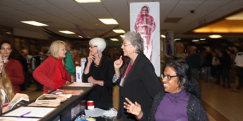 Visitors at the Welcome table.