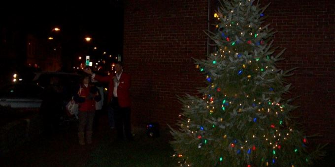 The Mayor of Beaver Dam lights the tree at the Chamber of Commerce to begin the holiday celebrations