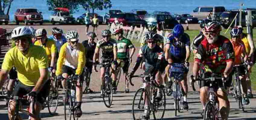 Riders depart from Thompson's West End Park in Washburn at the start of their tour.