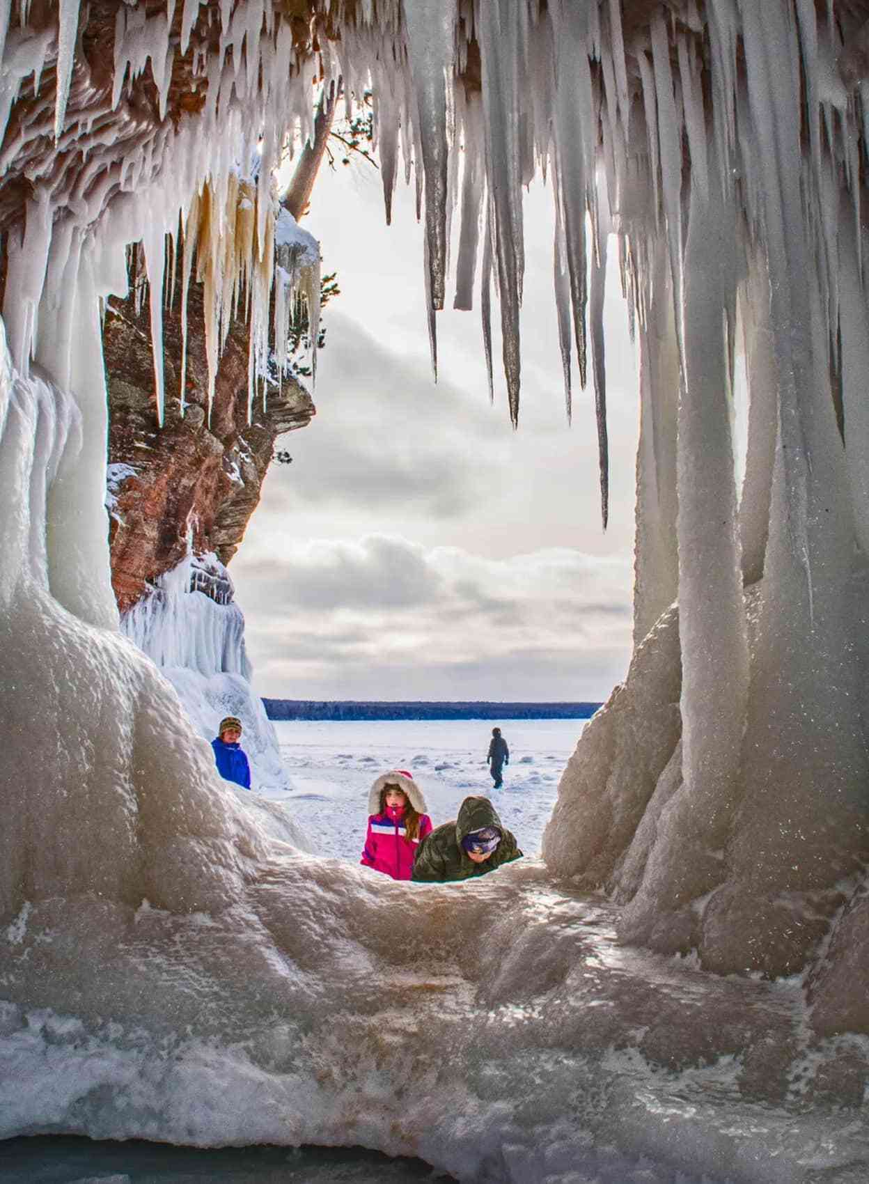 Children look at ice caves in Apostle Islands, Wisconsin