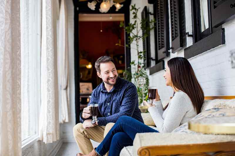 couple drinking coffee in maxwell mansion