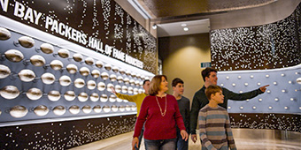 family looking at exhibits at the Green Bay Packers hall of fame