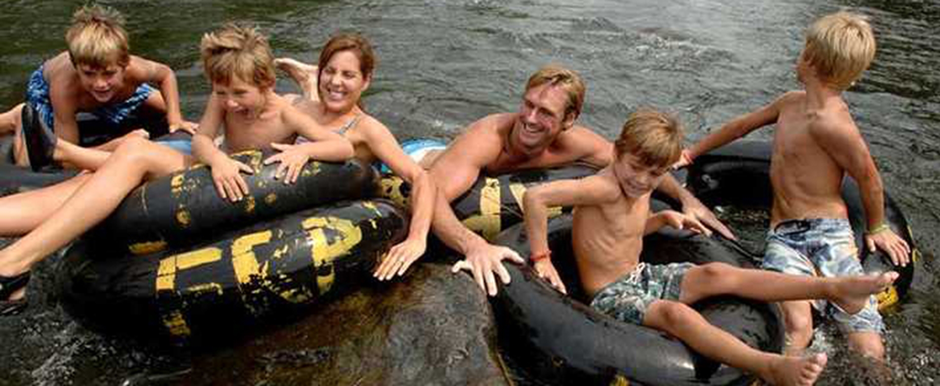 Family of six in inner tubes on the Apple River