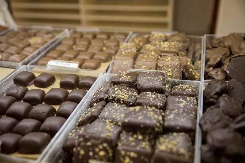 close up of chocolate candies in a display case