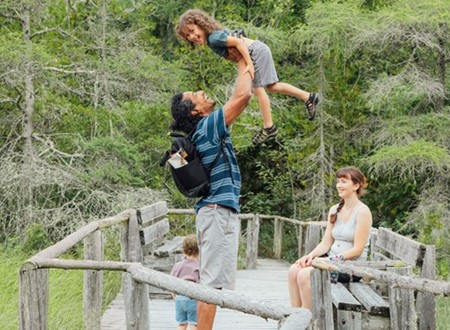 family exploring nature sanctuary loading=