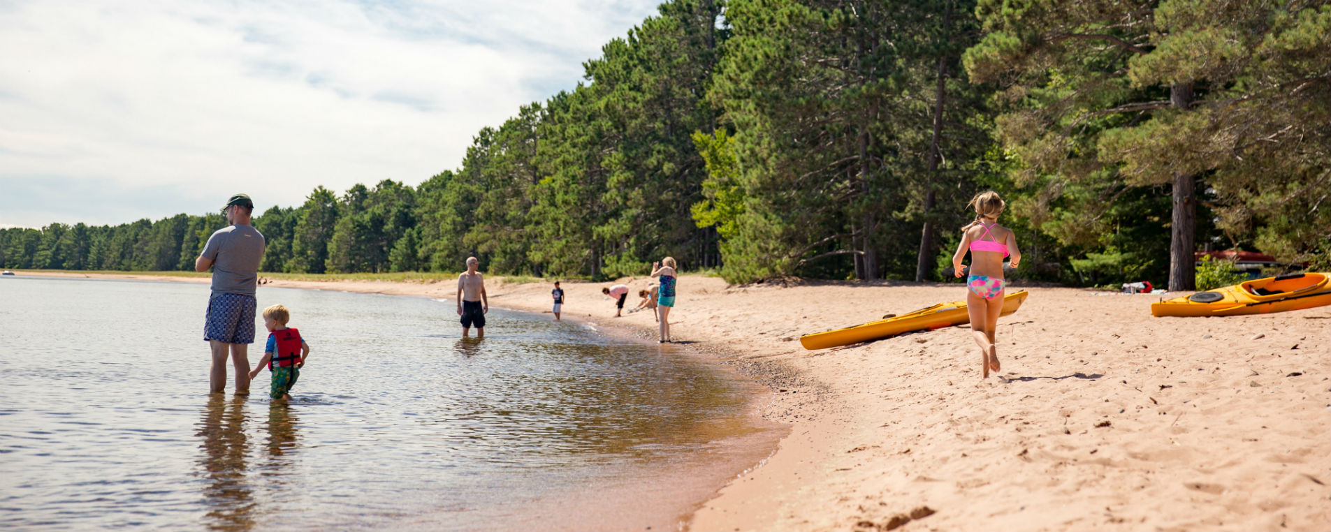 Family Enjoying the Beach at Big Bay Town Park