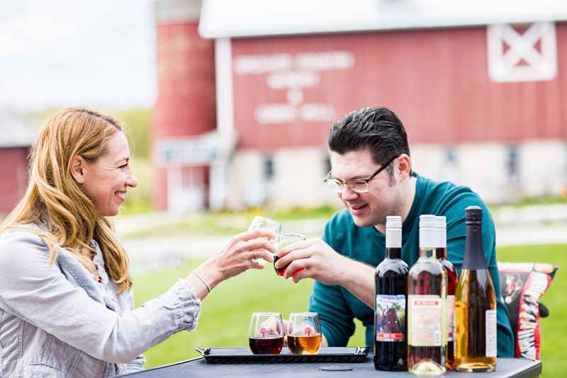 Couple enjoying a wine tasting at Lautenbach’s Orchard Country Winery & Market