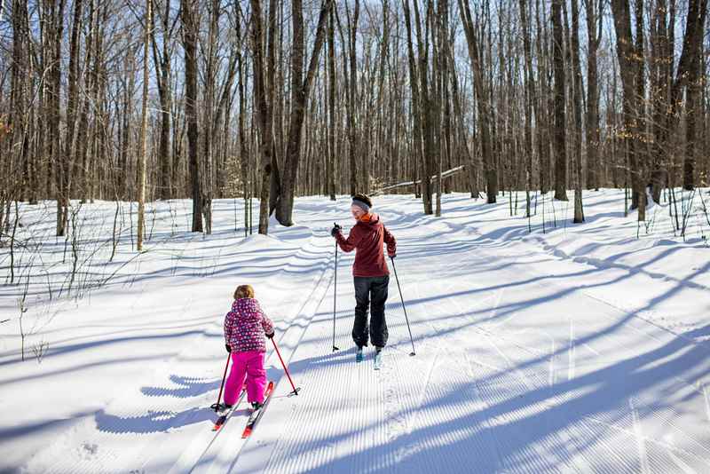 Mother and child cross-country skiing