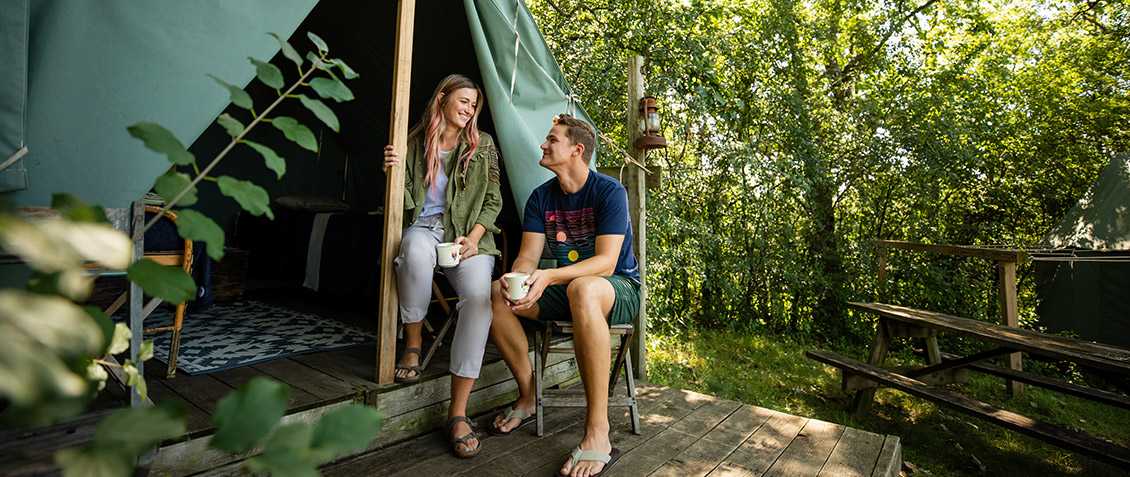 Couple Smiling in Tent at Camp Wandawega