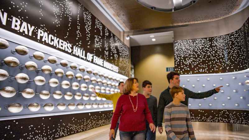 family walking through green bay packers hall of fame