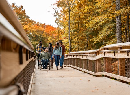 Walking through pathfriends walking up accessible pathway up observation tower loading=