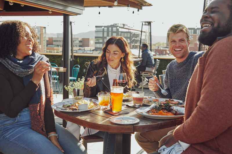 friends group dining at the rooftop restaurant at hotel charmant in La Crosse, Wisconsin