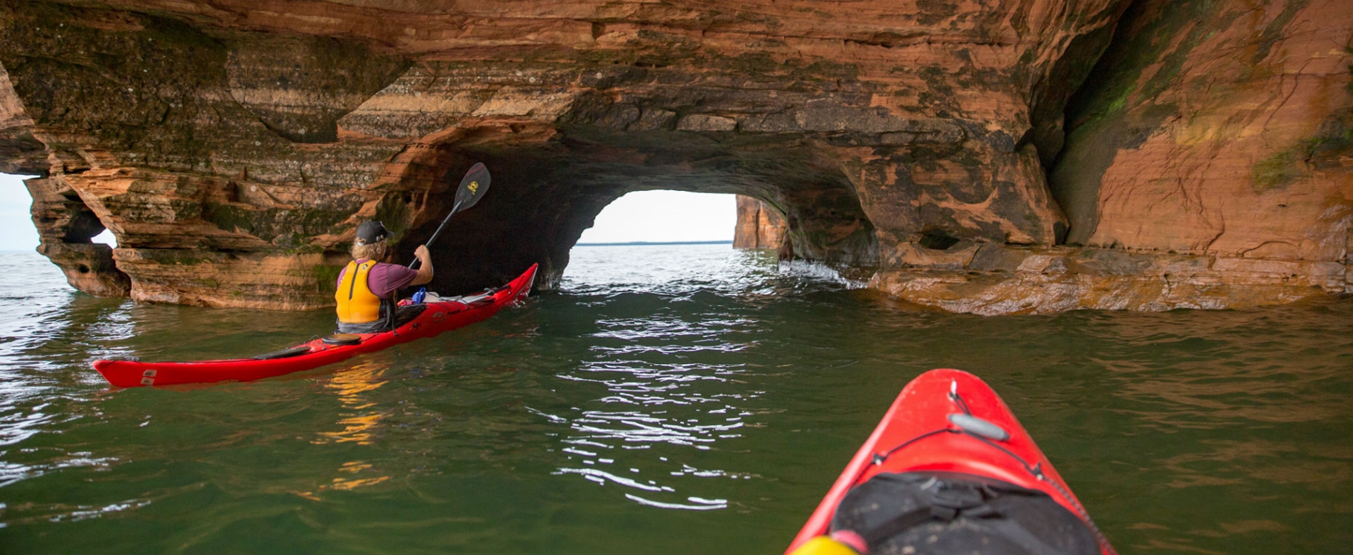 Kayakers Heading into Rock Formation at the Apostle Islands