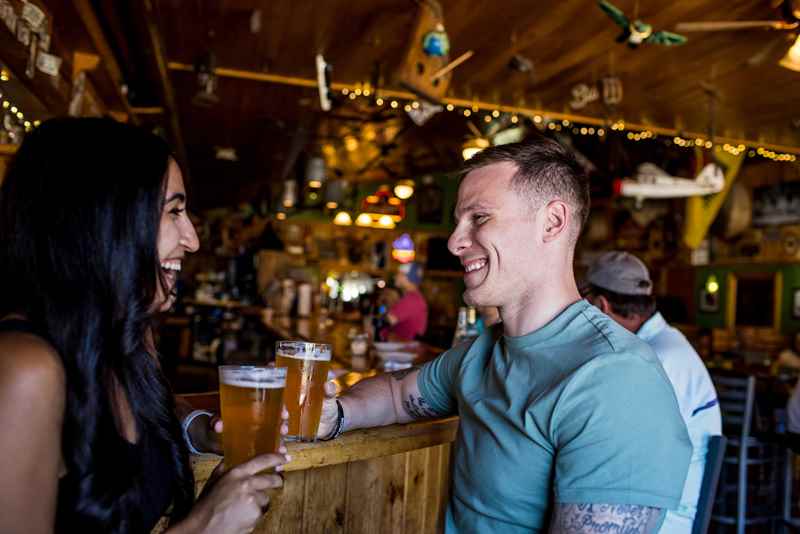 Couple Enjoys Beer-The Sawmill Saloon-Hayward, Wisconsin