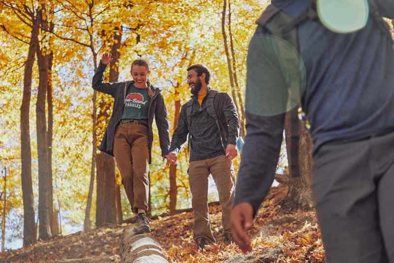 group of friends walking through the woods at grandad bluff park in la crosse