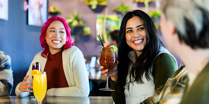 Friends have fancy drinks at a restaurant