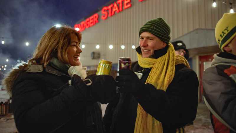 people standing outside badger state brewing