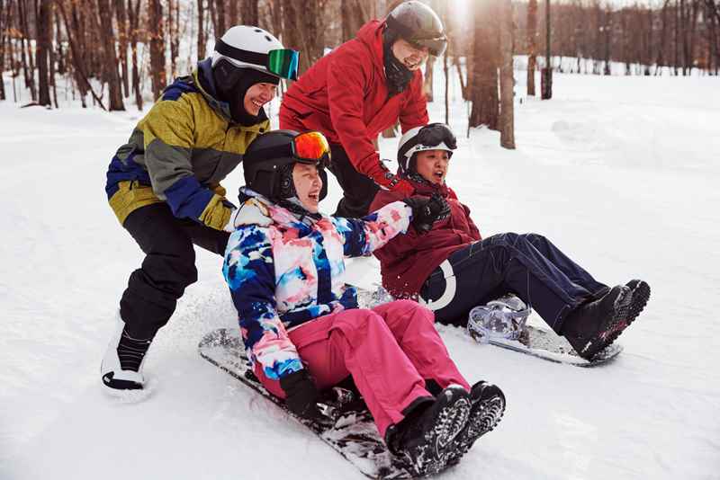 friends playing on snowboards at granite peak ski area in wausau