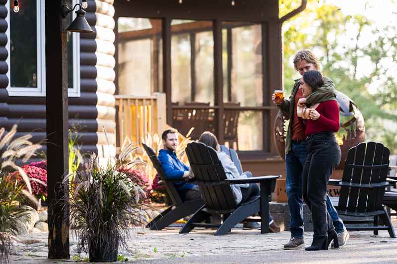 couple walking with drinks at northwood pines