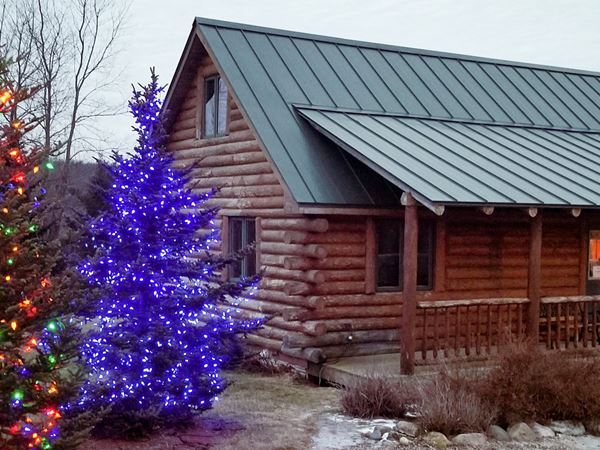 Cabin at Rustic Ridge Resort with Holiday Lights Up