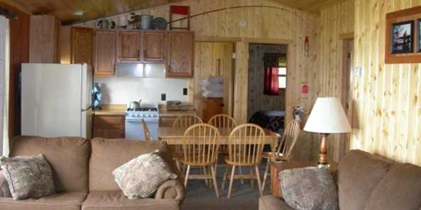Our cabins have all the amenities of home with fully equiped kitchens, DirecTV, fireplaces in some units, charcoal grill, picnic tables and ample storage for all of your equipment.