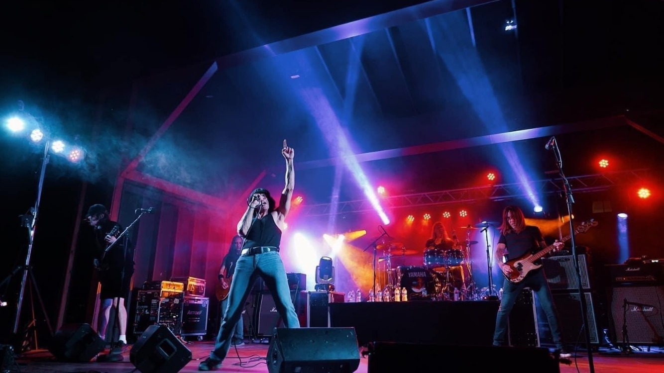 Band performing during a music festival at the Lake Geneva House of Music.
