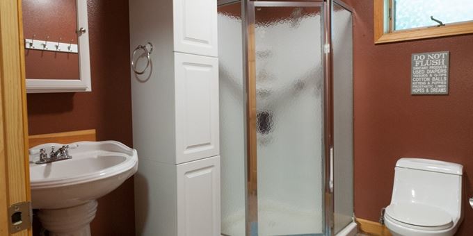 Bathroom has a standup shower.