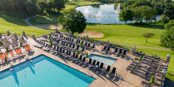 The outdoor pool overlooks The Brute Golf Course and our private lake.