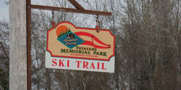 The sign from the road heading into Jack Lake Ski Trail, which is also known as Veteran&#39;s Memorial Park.
