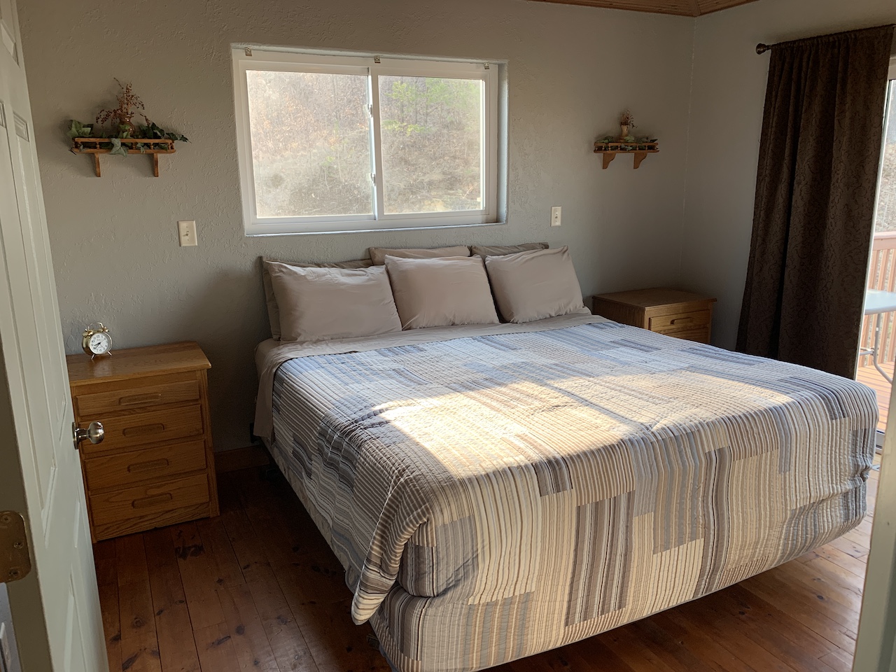 The king room's comfy bed invites you for a peaceful night's sleep.