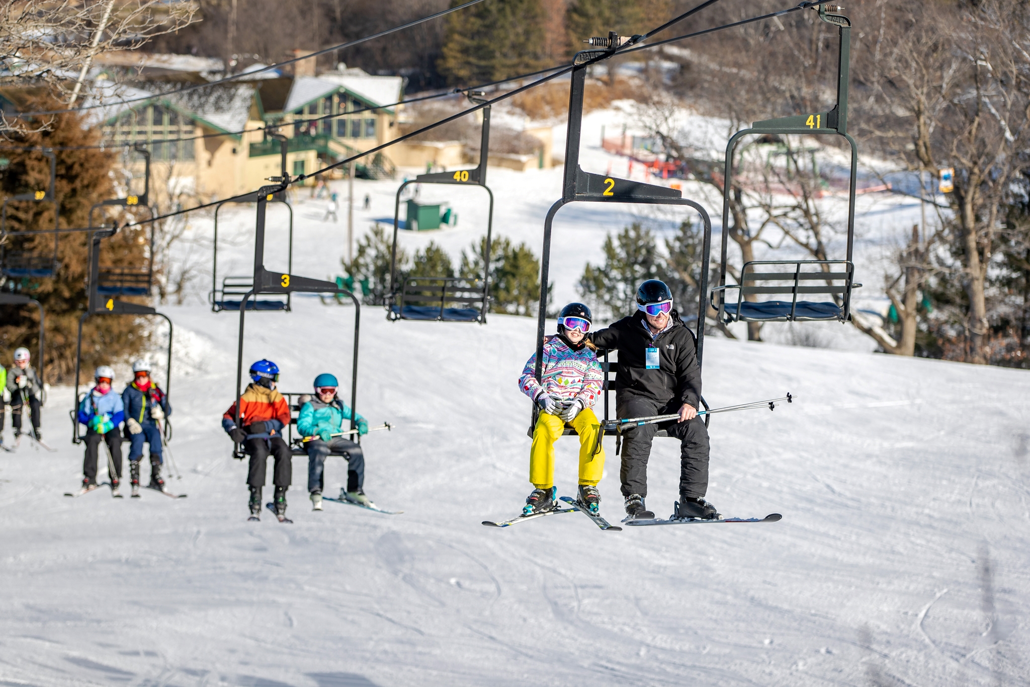 Distance view of skiers on the chairlift