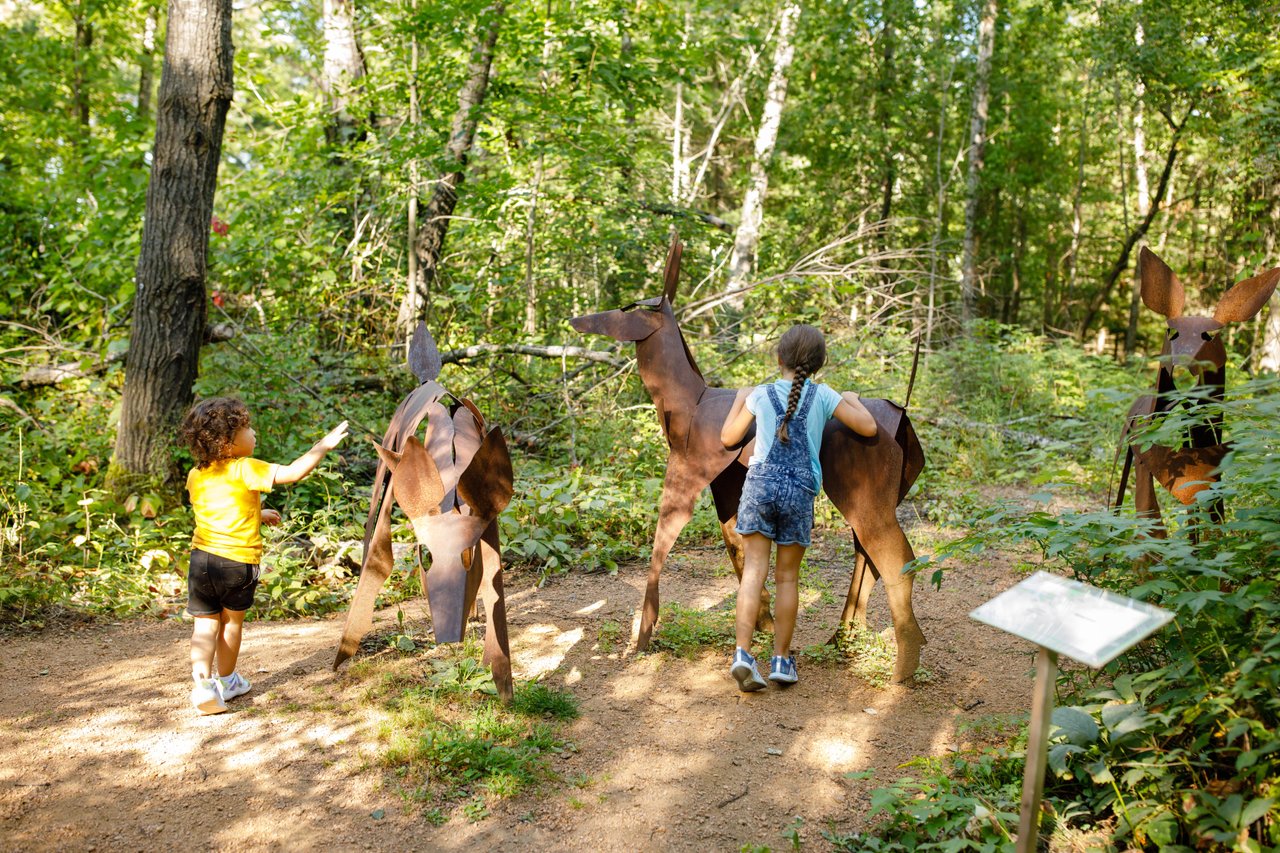 Kids at the Stevens Point Sculpture Park in the summertime.