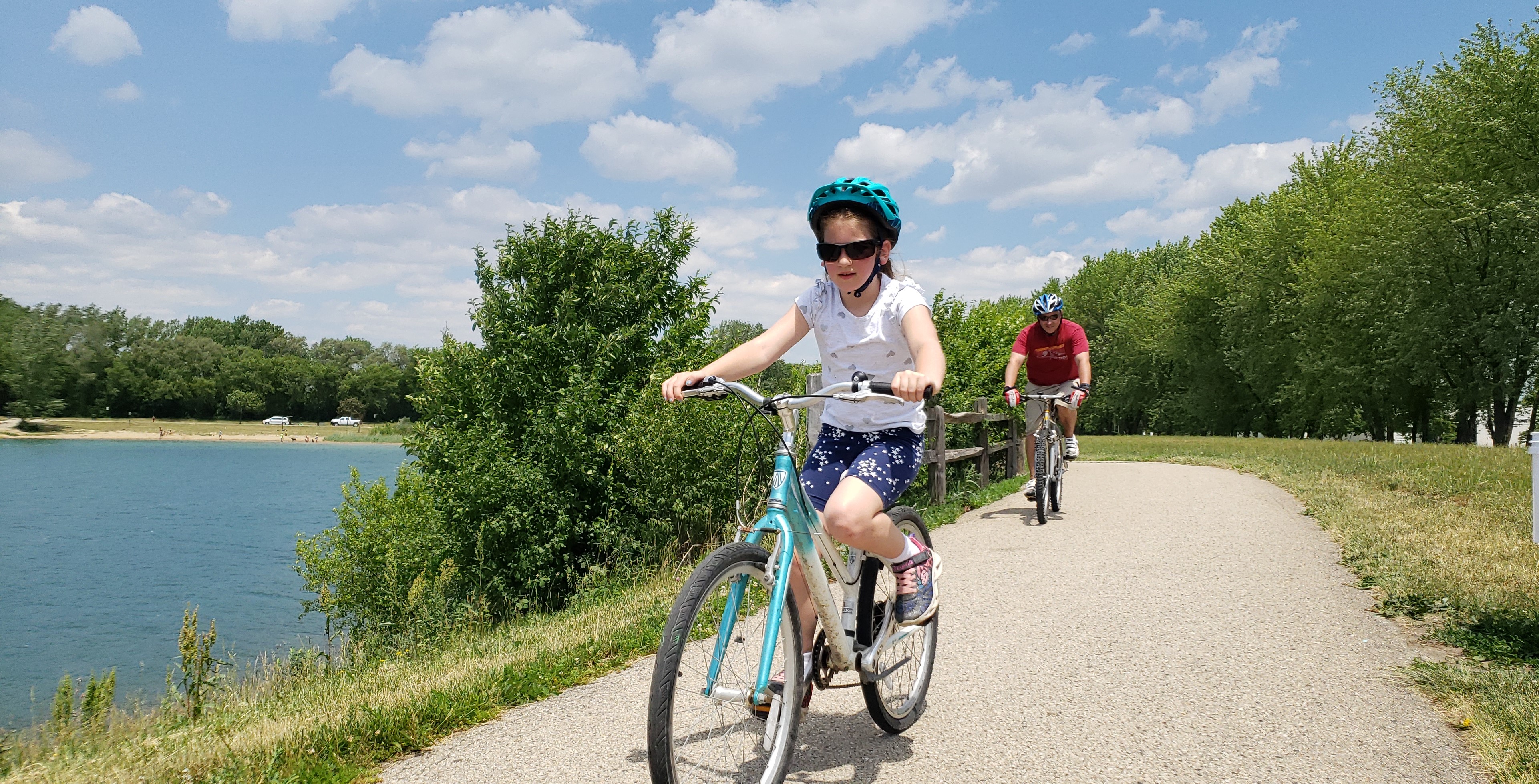 Biking the paved path around Lake Andrea in summer.