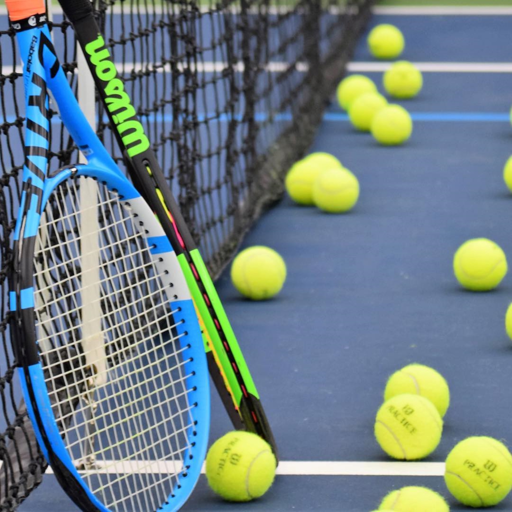 Rackets and balls on the courts.