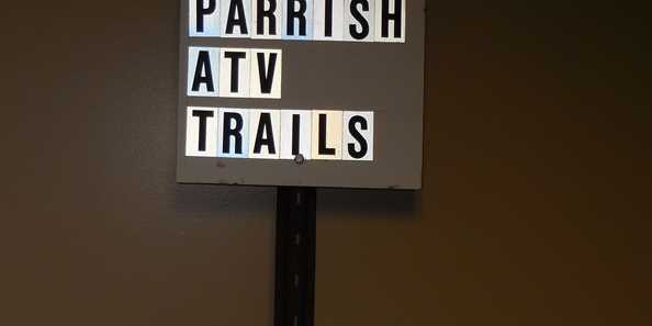 Signs directing ATV/UTVers to the Parrish AVT Trails.