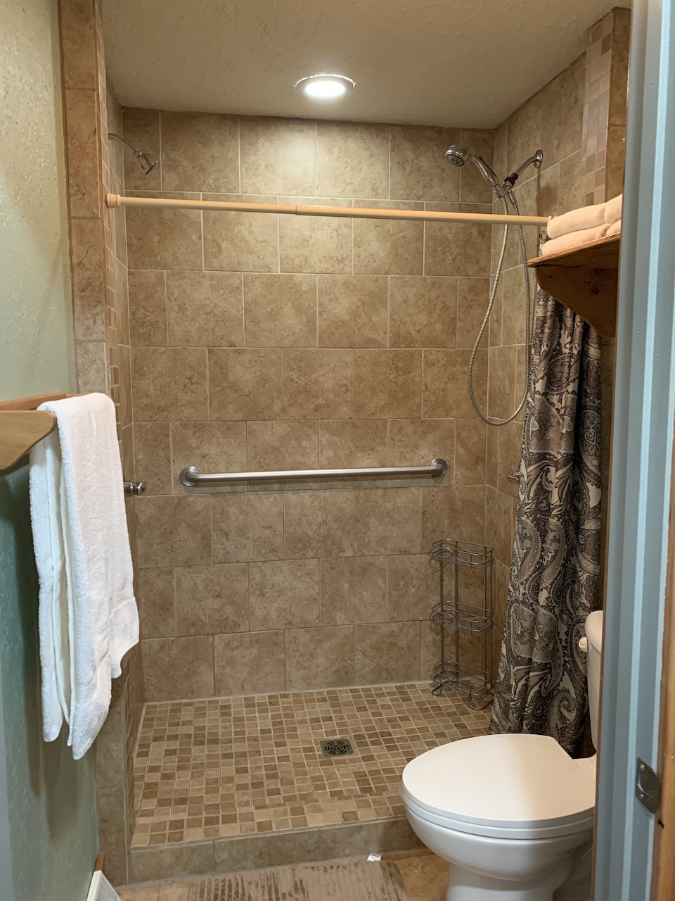 2 shower heads. Tell the kids it's so you can shower your front and back at once