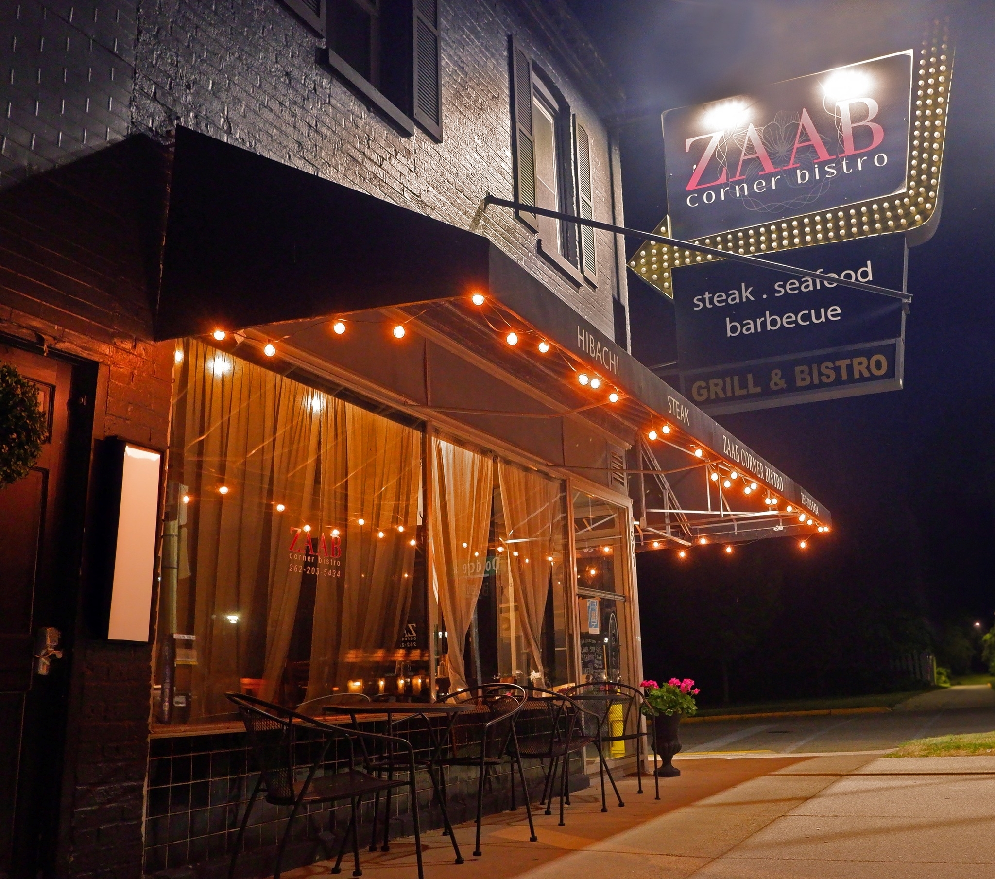 Zaab Bistro exterior at night.