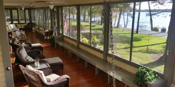 1200 foot Grand Porch with porch swing atLake Ripley Lodge