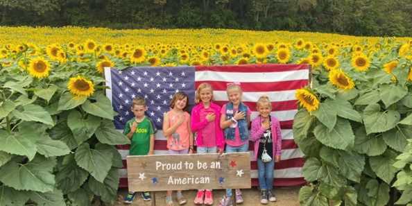 Capture your families memories in the sunflower field at Busy Barns Adventure Farm.