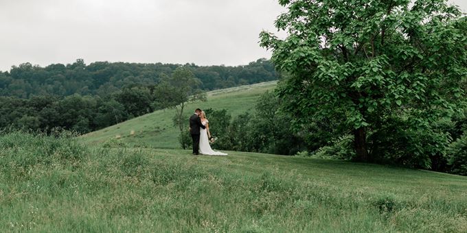 Grace and Sam Bayer just married atop a hill at Justin Trails Resort