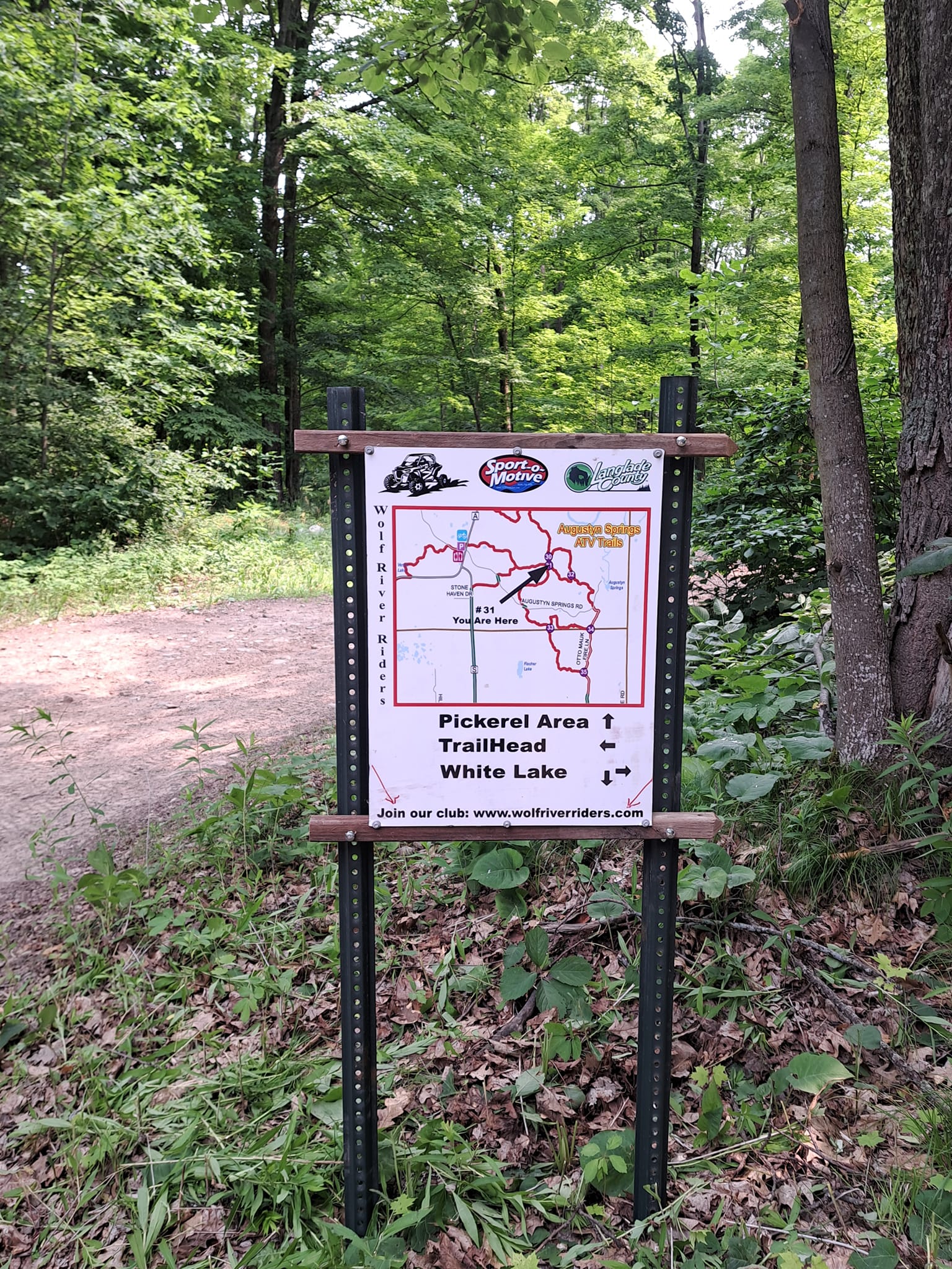 Trail signs along the Pickerel/Pearson ATV Trail provide helpful guidance, ensuring riders stay on course as they explore the scenic routes of Langlade County.