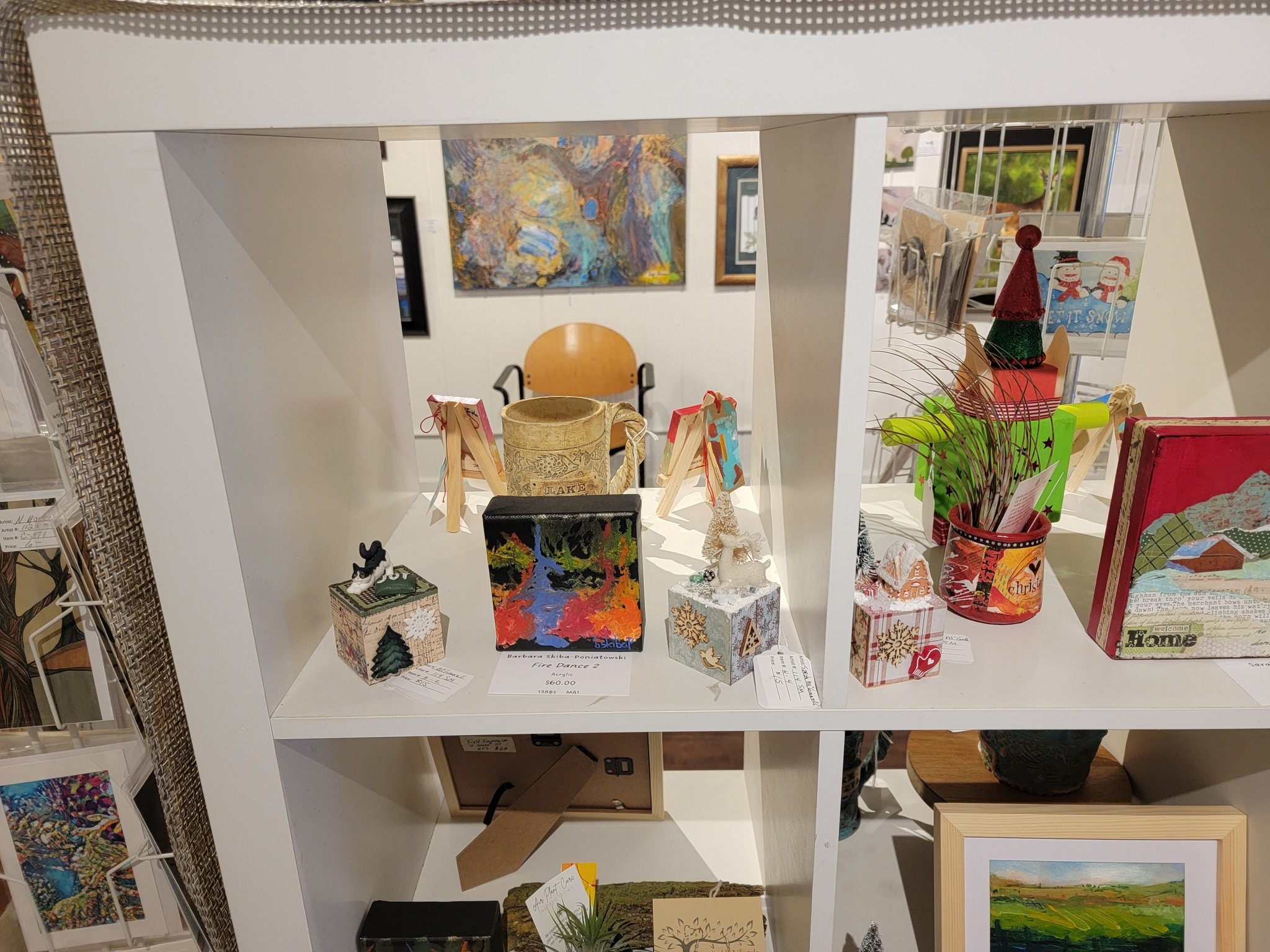 Shelves full of art exhibit items at Gallery 23.