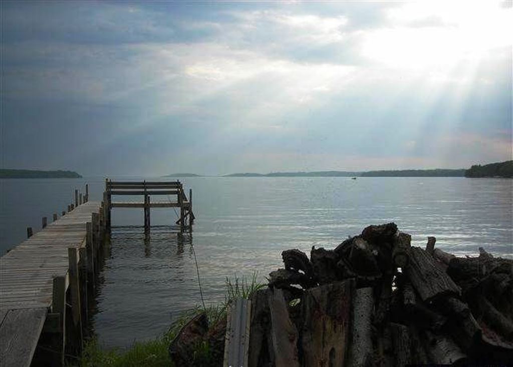 A great view down the center of Big Green Lake.  A great spot for a family.  Shallow, sandy bottom waters.  Enjoy sitting around the campfire while enjoying these view in this 4 bedroom 3 bath home.  G