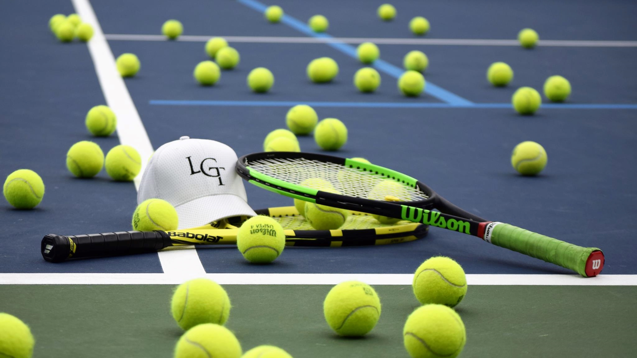 Tennis balls on the court.