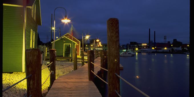 Rogers Street Fishing Village at night in Two Rivers.