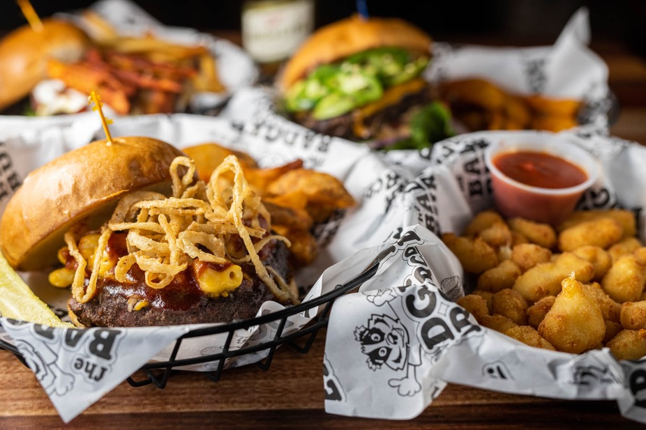 Baskets of food, including burgers, sandwiches and cheese curds.