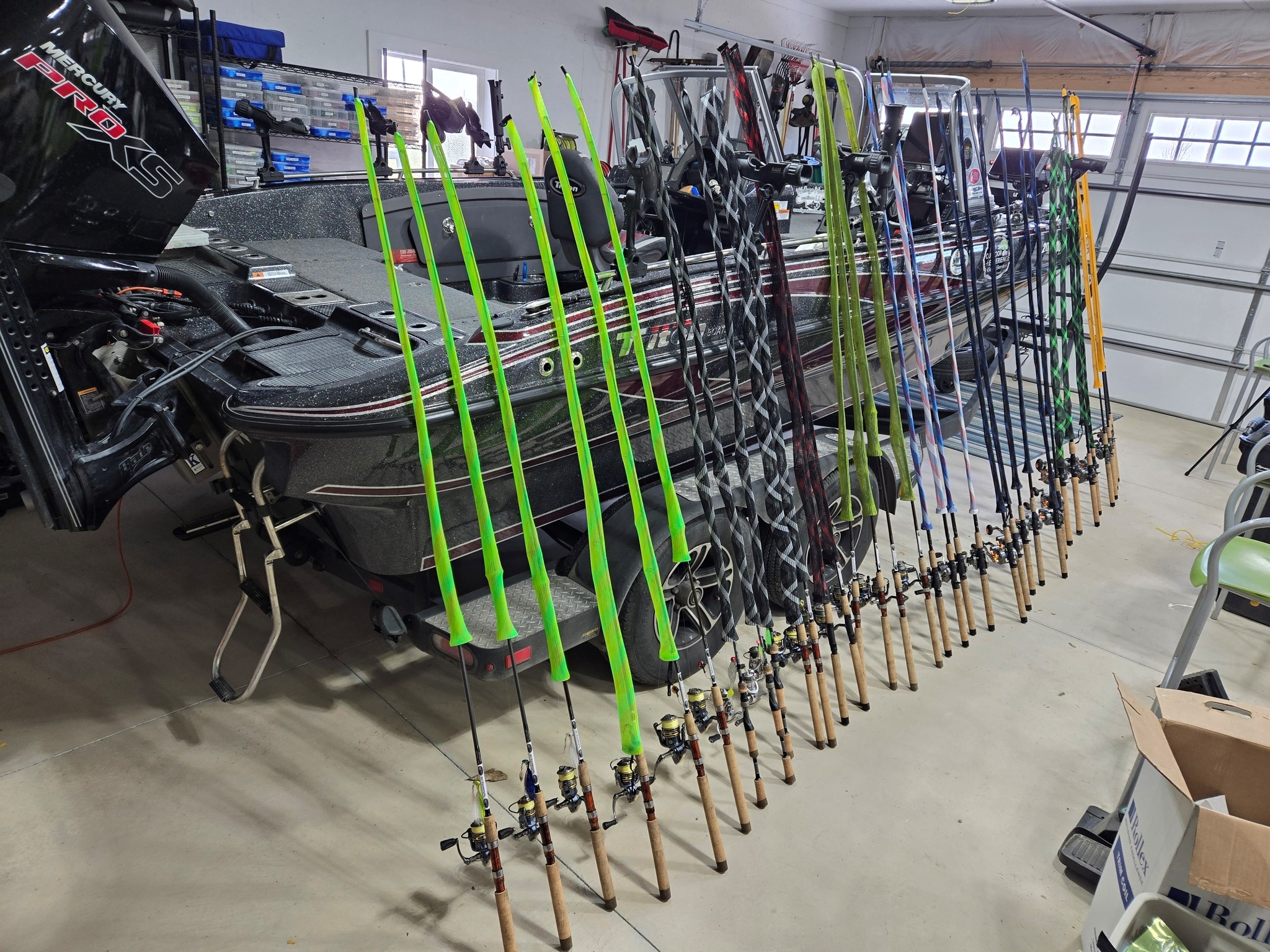 Fishing poles leaning against a boat before fishing.
