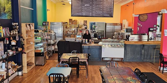 Owner Amy behind the counter at the vibrant downtown cafe Magpie Gelato