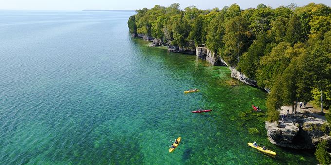 Kayak or take a zodiac speed boat by the gorgeous coastline of Cave Point County park