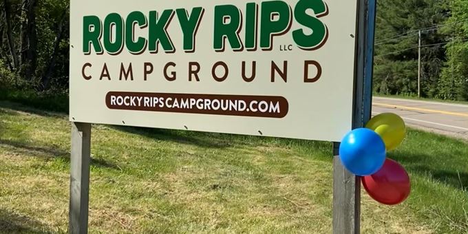 Sign welcoming campers to Rock Rips Campground.